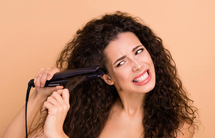 Using flat iron damages hair