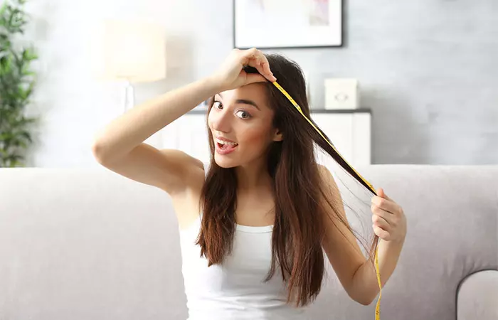 Woman checks hair growth progress after discontinuing Mirena