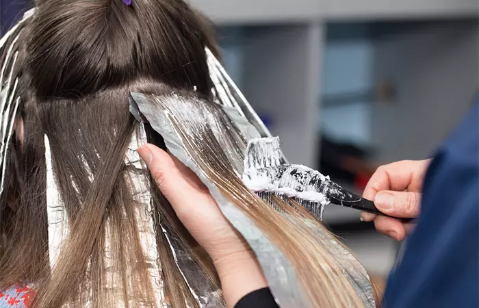 Woman getting her hair dyed