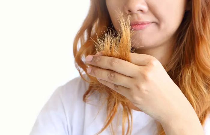 Woman with faded hair color after using clarifying shampoo