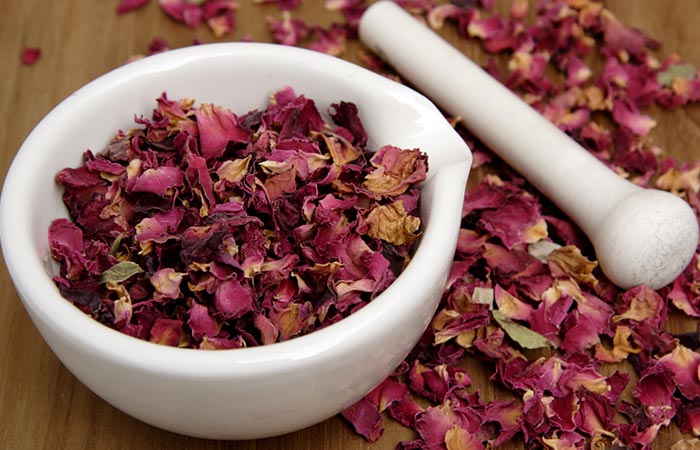 Dried rose petals with mortar and pestle