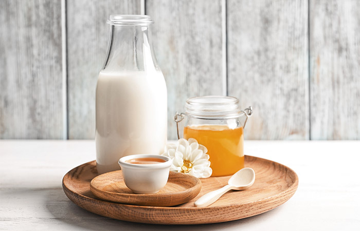 Jars of milk and honey for shiny moisturized skin