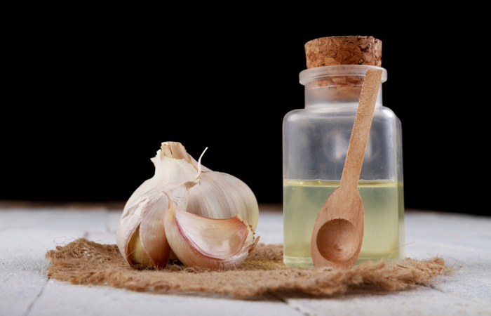 Raw garlic juice in a glass container