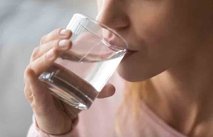 Close up of a woman drinking water