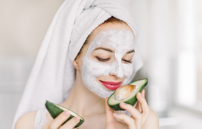 Woman with avocado face mask