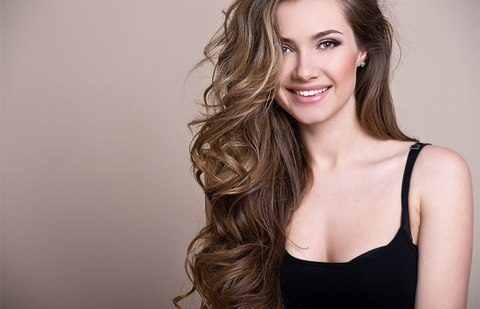 Woman with voluminous hair after hair gloss treatment