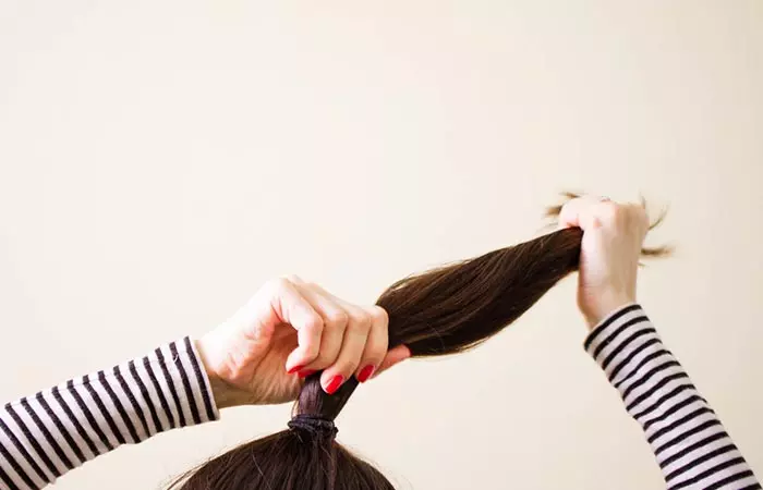 Woman with elastic hair tying a hair band