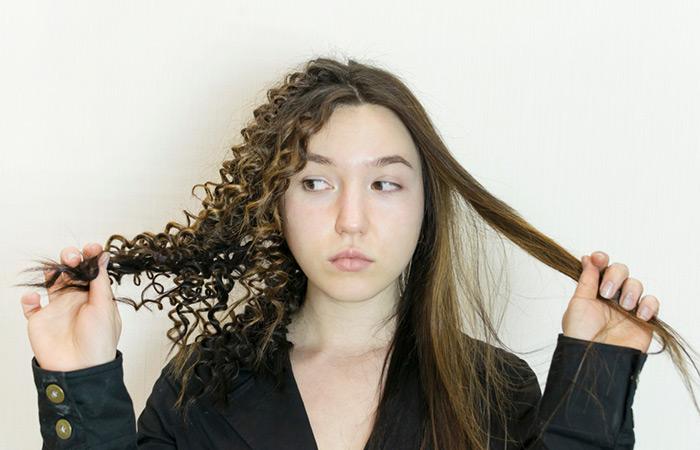 Woman Showing the difference between relaxed and curly hair