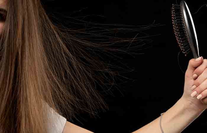 Woman with static hair after hair straightening