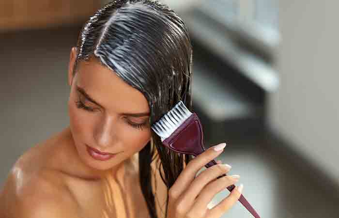 Woman applying deep-conditioning hair mask