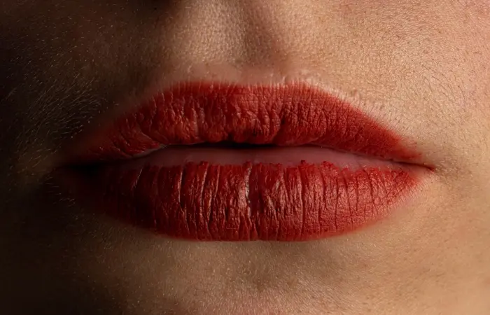 A woman wearing red lipstick 