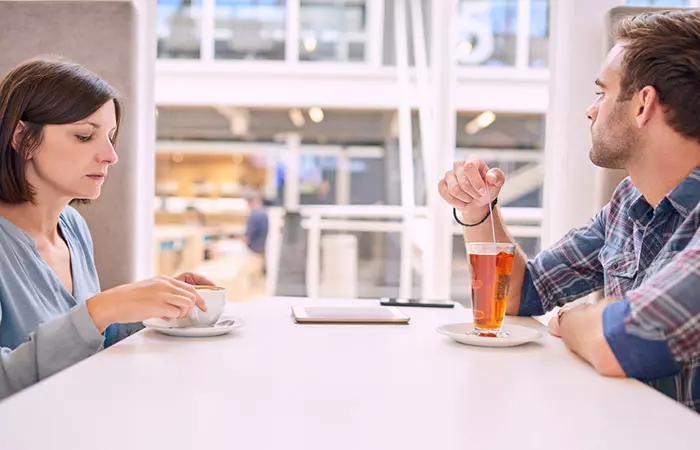 A man avoiding eye contact with his wife