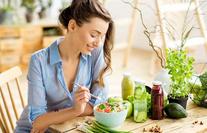 Woman eating a healthy diet to deal with hair loss after surgery