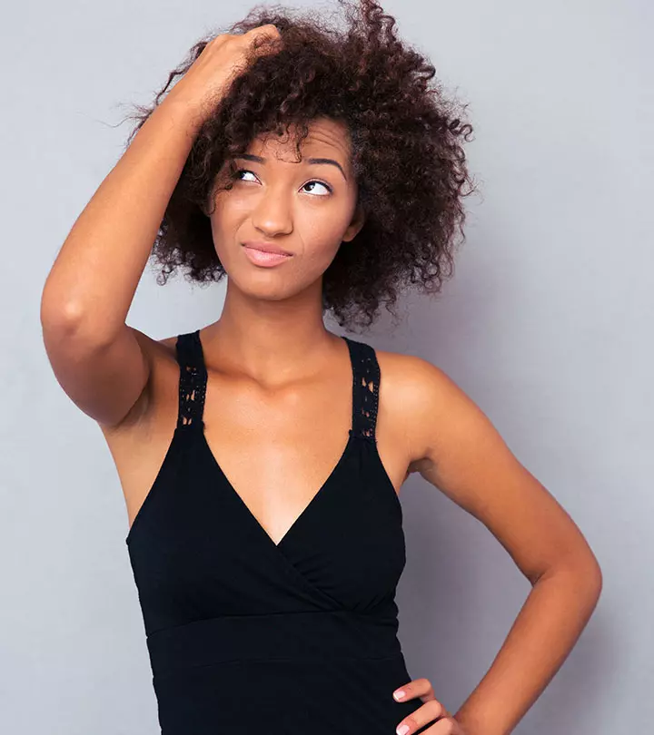 Woman sleeping on a pillow with curly hair