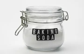 A jar of baking soda to be mixed with tea tree oil to exfoliate and clean out the warts
