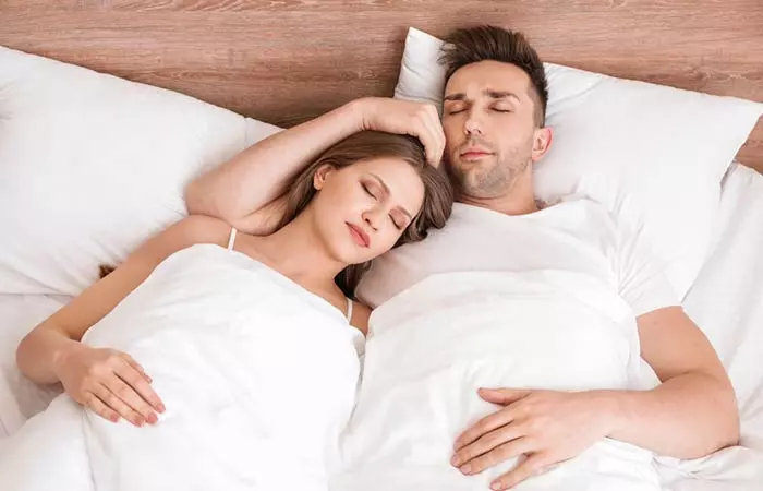 The arm around couple sleeping position