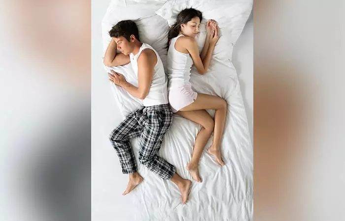 The butt-to-butt couple sleeping position
