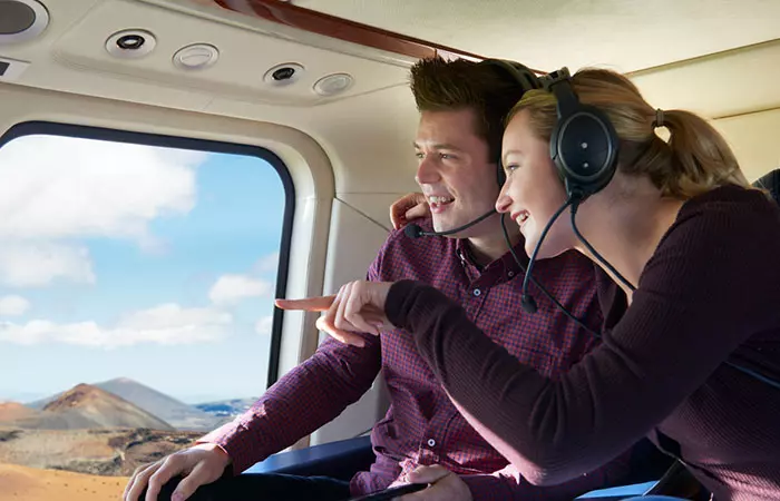 Couple enjoying a helicopter ride