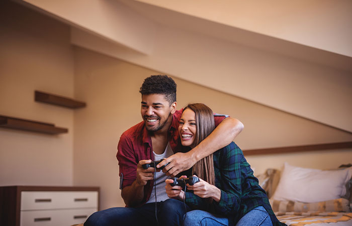 Couple having fun playing video games