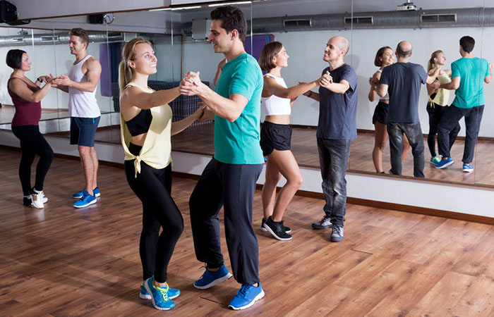 Couples attending dancing class