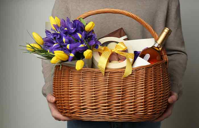 Gift basket with flowers, wine and chocolates