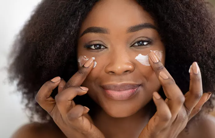 Woman using eye cream that contains CoQ10 