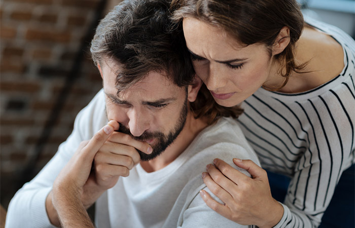 Woman supporting her man as a sign of emotional connection