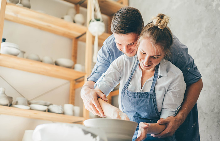 Couple working on pottery wheel as a hobby is a sign of emotional connection