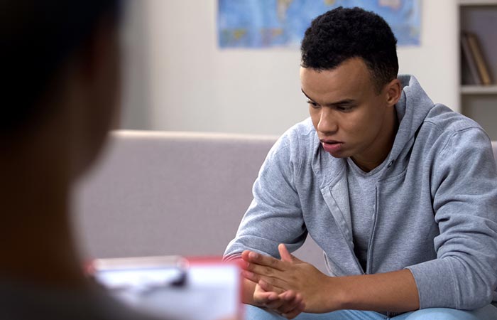 Upset young adult man in a counseling session to heal from disorganized attachment