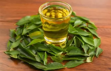 Use curry leaves and coconut oil for hair loss