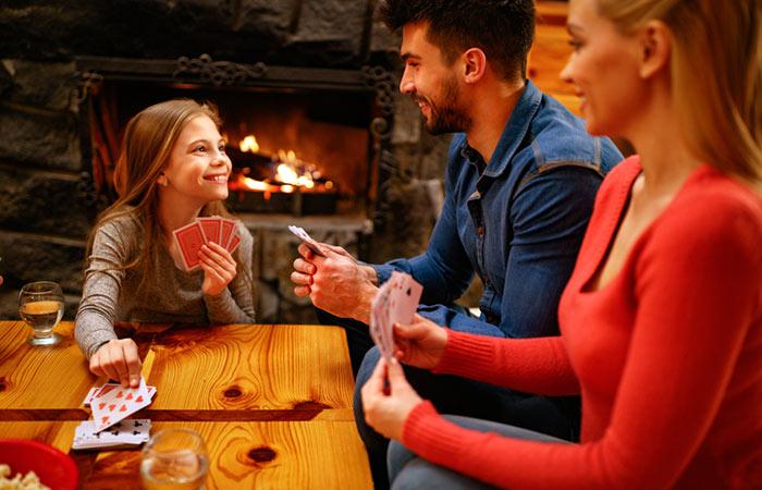 Family playing a card game