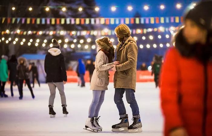 Couple ice skating romantically