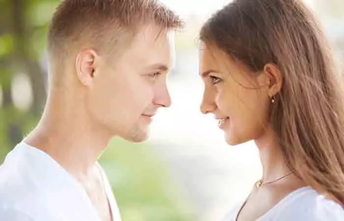 A boy and girl looking at each other with an intention to commit to each other. 