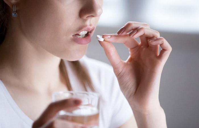 Woman taking medication 
