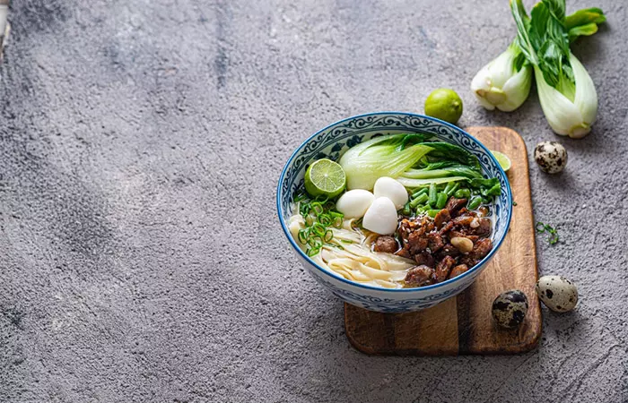 Bowl of chicken and bok choy soup