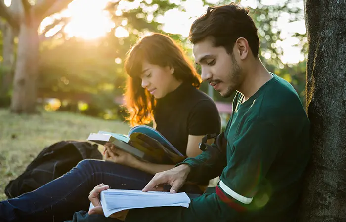 A couple reading side-by-side