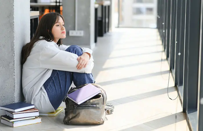 A lonely woman sitting on her own