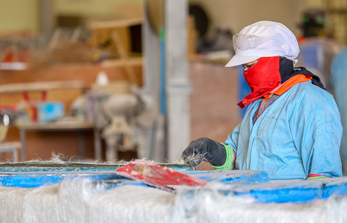A person working with fiberglass