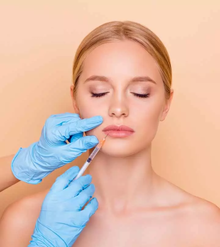 Women getting lip filler treatment