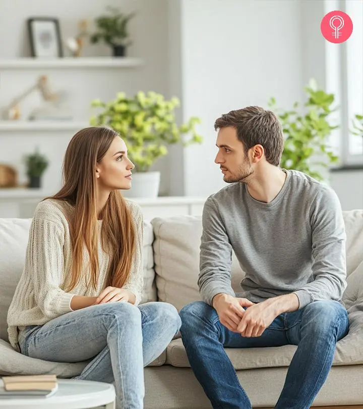 A man holds his partner's hand