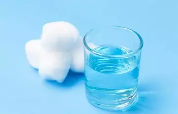 Cotton balls and a glass of diluted hydrogen peroxide