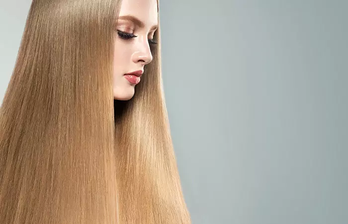 Blonde model with flawlessly done permanent hair straightening