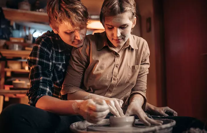 Couple practicing pottery together