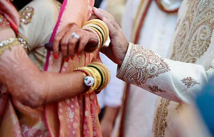 Mother-In-Law Washing The Groom's Feet