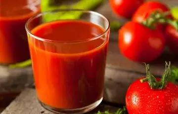 Closeup of a glass of tomato juice for glowing skin