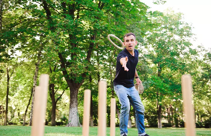 A member of the family playing ring toss