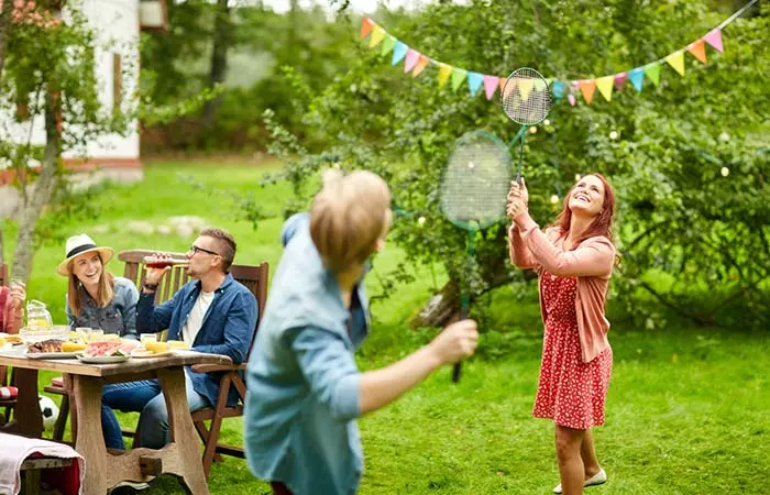 Family playing badminton