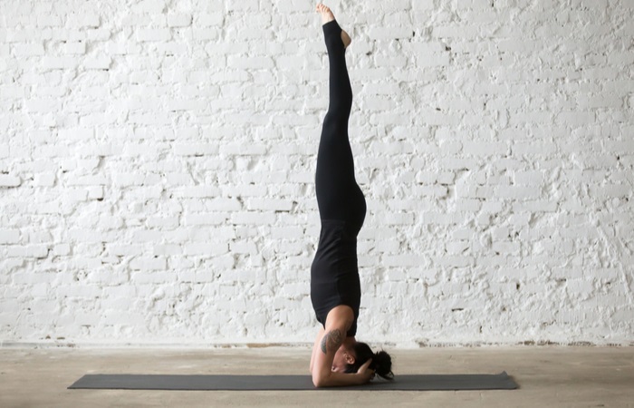 young-yogi-attractive-woman-practicing-yoga-619047908