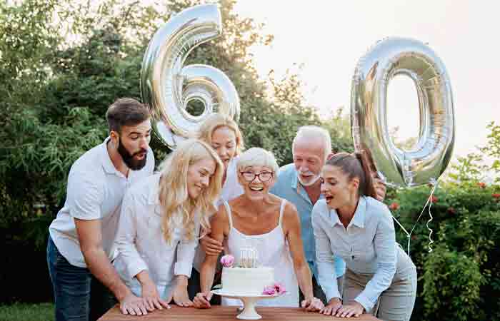 Family celebrating their mom's 60th birthday