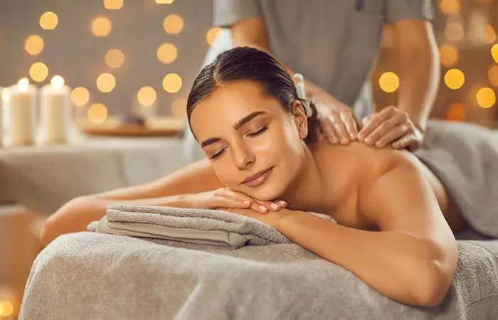 A woman getting a full-body massage for stress relief